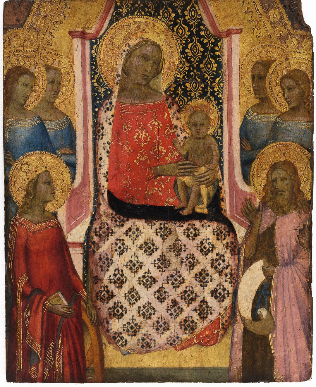 Historical painting depicts the Madonna and Child, surrounded by four golden-radiant saints, two on each side. All figures are depicted with halos. The Madonna wears a red robe embroidered with golden flowers and holds the child on a lap covered with a black and gold pattern. Against a detailed golden background.